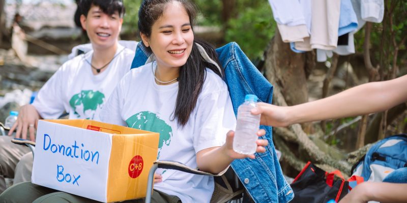 group-of-asian-diverse-people-volunteer-holding-a-donation-box-for-fundraiser-to-emergency-situation.jpg